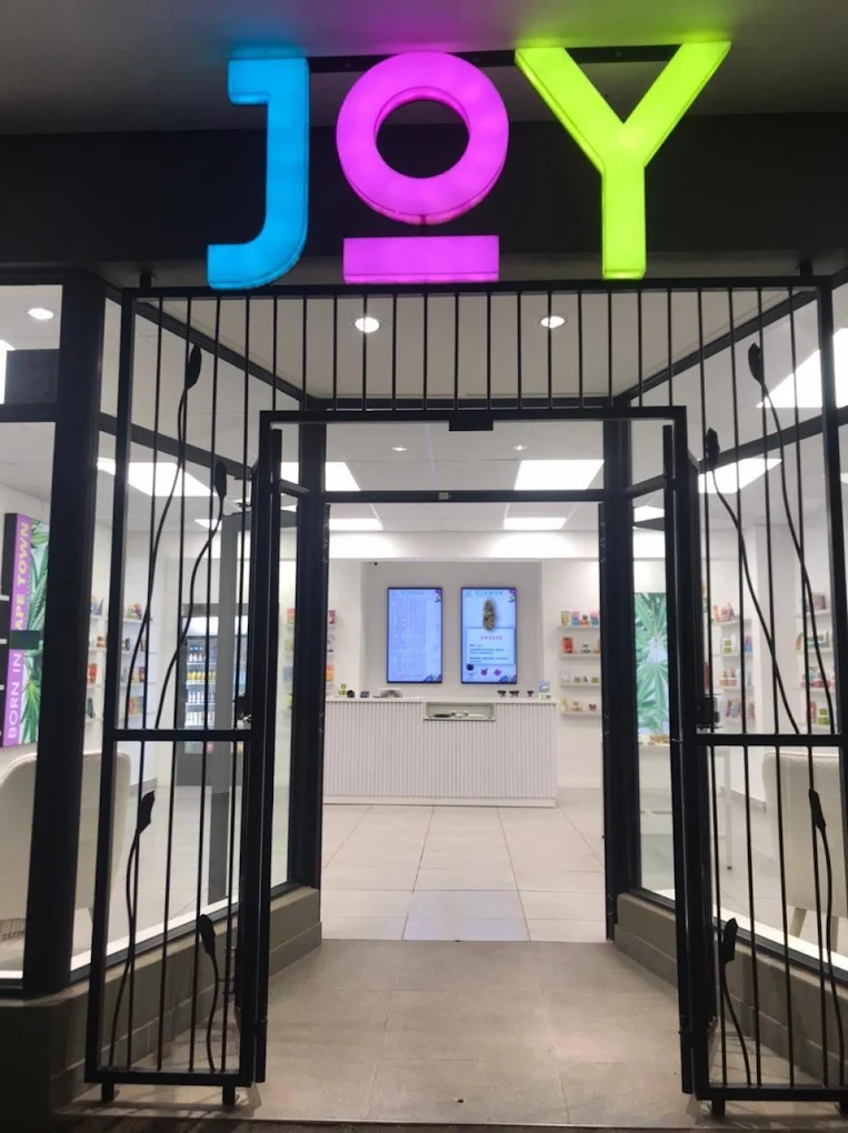 joy medical cannabis strand street exterior logo